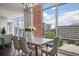 Bright dining area with large windows showcasing urban scenery, complemented by a sleek dining set at 1820 Peachtree St # 614, Atlanta, GA 30309