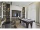 Game room with a pool table, seating, and modern entertainment setup at 1820 Peachtree St # 614, Atlanta, GA 30309