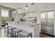 Modern kitchen with stainless steel appliances, granite countertops, and an island with bar seating at 1820 Peachtree St # 614, Atlanta, GA 30309