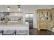 Bright kitchen with stainless steel appliances, granite countertops, white cabinets, and island with bar stools at 1820 Peachtree St # 614, Atlanta, GA 30309