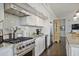 Well-equipped kitchen with stainless steel appliances, granite countertops, and custom cabinetry at 1820 Peachtree St # 614, Atlanta, GA 30309