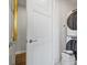 Well-lit laundry room featuring a stacked washer and dryer and ample towel storage at 1820 Peachtree St # 614, Atlanta, GA 30309