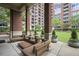 Outdoor lounge area featuring comfortable couches and stylish landscaping at 1820 Peachtree St # 614, Atlanta, GA 30309