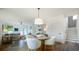 Open-concept living space with dining area, stairs, and access to outdoor space at 1834 Butterfly Way, Marietta, GA 30066