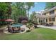 The backyard has a swimming pool, patio, dining area, and outdoor lounge seating at 3456 Drayton Ne Dr, Roswell, GA 30075