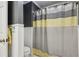 Bathroom features a tub/shower with a modern shower curtain at 3456 Drayton Ne Dr, Roswell, GA 30075