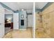 The shower has travertine walls and multiple shower heads at 3456 Drayton Ne Dr, Roswell, GA 30075
