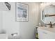 Small bathroom featuring a unique sink, neutral walls, and a decorative mirror at 3456 Drayton Ne Dr, Roswell, GA 30075