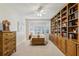 Bedroom with bay window, hardwood floors, and custom built-in bookshelves at 3456 Drayton Ne Dr, Roswell, GA 30075