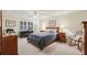 This is a well-lit bedroom with a ceiling fan, a desk and rolling chair at 3456 Drayton Ne Dr, Roswell, GA 30075