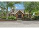 Exterior shot of the brick clubhouse featuring a symmetrical design and well-kept landscaping at 3456 Drayton Ne Dr, Roswell, GA 30075