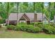 Charming brick home with lush landscaping and mature trees offering great curb appeal at 3456 Drayton Ne Dr, Roswell, GA 30075