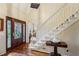 Elegant foyer with hardwood floors, staircase, and decorative front door with glass accents at 3456 Drayton Ne Dr, Roswell, GA 30075