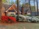 Classic brick home with manicured landscaping and vibrant azaleas, creating inviting curb appeal at 3456 Drayton Ne Dr, Roswell, GA 30075