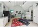 Well-lit garage featuring gym equipment, a refrigerator, and organized storage solutions at 3456 Drayton Ne Dr, Roswell, GA 30075