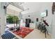 This is a well-lit garage with a treadmill, a bicycle, and large storage cabinets at 3456 Drayton Ne Dr, Roswell, GA 30075