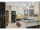 Spacious kitchen with stainless steel appliances, center island, and natural light at 3456 Drayton Ne Dr, Roswell, GA 30075