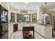 Updated kitchen featuring granite countertops, white cabinets, and modern stainless steel appliances at 3456 Drayton Ne Dr, Roswell, GA 30075