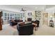 Spacious living room featuring a fireplace, built-in bookshelves, and ample natural light from large windows at 3456 Drayton Ne Dr, Roswell, GA 30075
