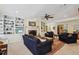 Inviting living room with fireplace, built-in shelving, and comfortable seating arrangement on neutral carpet at 3456 Drayton Ne Dr, Roswell, GA 30075