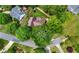 Aerial view of a home nestled among lush trees, showcasing the surrounding neighborhood at 503 Bonnie Dr, Woodstock, GA 30188