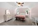 Comfortable bedroom with pastel pink walls, chair railing, and bright windows at 503 Bonnie Dr, Woodstock, GA 30188
