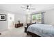 Bright bedroom featuring a large window, plush carpet, and neutral gray wall color at 503 Bonnie Dr, Woodstock, GA 30188