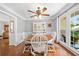 Charming dining room with wainscoting, a round table, and plenty of natural light at 503 Bonnie Dr, Woodstock, GA 30188
