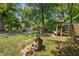 Charming front yard with well-maintained landscaping, a decorative water feature, and a welcoming bench at 503 Bonnie Dr, Woodstock, GA 30188