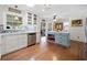 Bright kitchen with white cabinets, stainless steel appliances, backsplash, and a large blue island at 503 Bonnie Dr, Woodstock, GA 30188