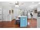 Large eat-in kitchen features a blue island, hardwood floors, and ample cabinet space at 503 Bonnie Dr, Woodstock, GA 30188