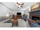 Comfortable living room featuring a fireplace, hardwood floors, and stylish furniture at 503 Bonnie Dr, Woodstock, GA 30188