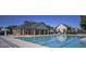 Community pool with sparkling water and a sunbathing area, perfect for summer relaxation at 1023 Bentley Estates Dr, Dacula, GA 30019
