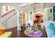 Inviting living area features hardwood floors, colorful decor, and an open layout, seamlessly connecting spaces at 1023 Bentley Estates Dr, Dacula, GA 30019