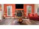 Cozy living room with a stone fireplace, hardwood floors and natural light at 1023 Bentley Estates Dr, Dacula, GA 30019