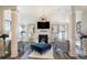 Bright living room features high ceilings, modern chandelier, and elegant decor perfect for entertaining guests at 1023 Bentley Estates Dr, Dacula, GA 30019