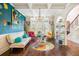 Eclectic living room boasts colorful decor, unique artwork, and hardwood floors, offering a vibrant space at 1023 Bentley Estates Dr, Dacula, GA 30019