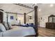 Spacious main bedroom boasts high ceilings, seating area, and a decorative canopy bed for luxurious comfort at 1023 Bentley Estates Dr, Dacula, GA 30019