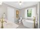 Bathroom with tub, shower, and double sinks at 4027 Mount Vernon Dr, Woodstock, GA 30189