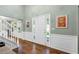 Bright foyer with hardwood floors and white wainscoting at 4027 Mount Vernon Dr, Woodstock, GA 30189