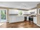Well-lit kitchen with white cabinetry, stainless steel appliances, and tile backsplash at 4027 Mount Vernon Dr, Woodstock, GA 30189