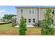 Backyard view with a small patio and young trees planted at 4541 Moray Dr, Mableton, GA 30126