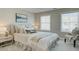Bright bedroom with a comfortable bed, decorative pillows, and plenty of natural light from two large windows at 4541 Moray Dr, Mableton, GA 30126