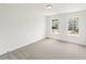 Spacious bedroom with carpet flooring and plenty of natural light from the window at 4541 Moray Dr, Mableton, GA 30126
