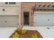 New brick home with a two car garage and a gray front door at 4541 Moray Dr, Mableton, GA 30126