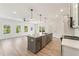 Modern kitchen with a large center island, stainless steel appliances, and ample natural light at 4541 Moray Dr, Mableton, GA 30126