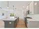 A bright kitchen with a large island, modern appliances, and stylish pendant lights at 4541 Moray Dr, Mableton, GA 30126