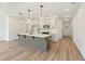 Well-lit kitchen with a center island, pendant lighting, and stainless steel microwave at 4541 Moray Dr, Mableton, GA 30126