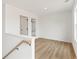 Well-lit loft space featuring wood floors, a window, and a light colored trim at 4541 Moray Dr, Mableton, GA 30126