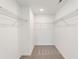 Walk-in closet with carpeted floor, white walls, and metal shelving at 4541 Moray Dr, Mableton, GA 30126